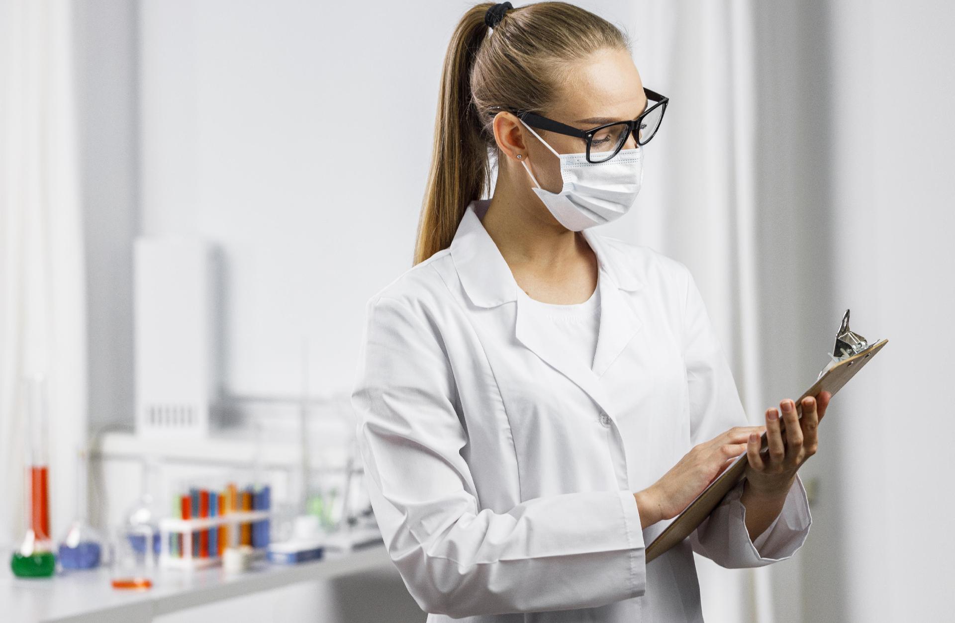 portrait-female-researcher-with-medical-mask-clipboard.jpg